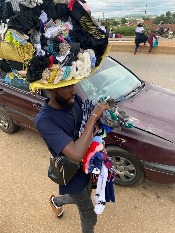 Midday street life and market activity in Bukuru, Nigeria