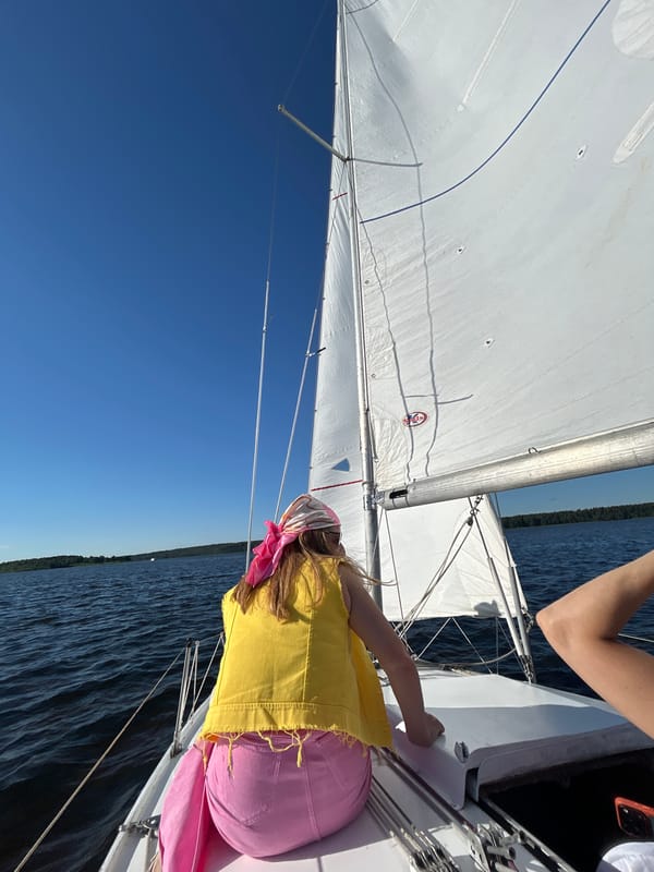 Sailing on calm water near Izhevsk on a clear summer day