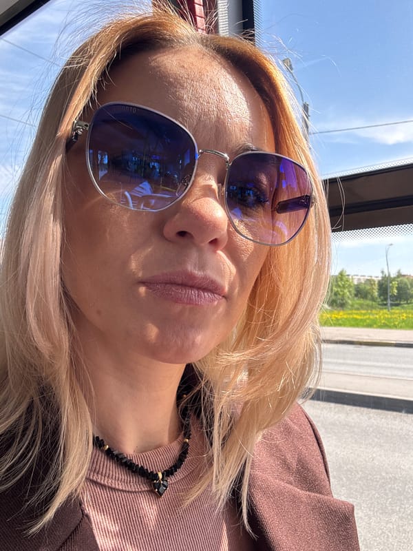 Woman travels through sunny Murino amid spring flowers