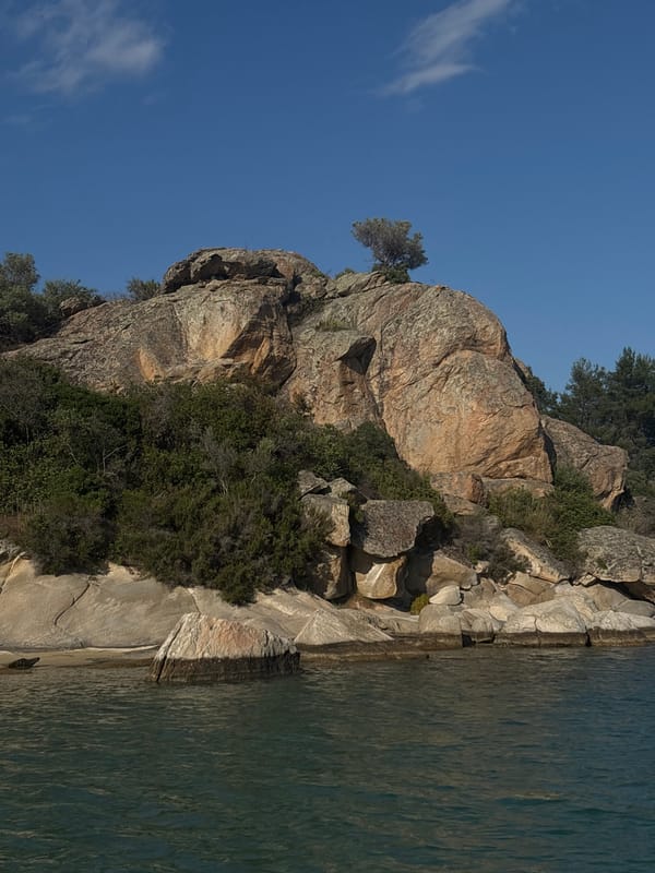 Coastal scenes documented along Sithonia's rocky shoreline and turquoise waters