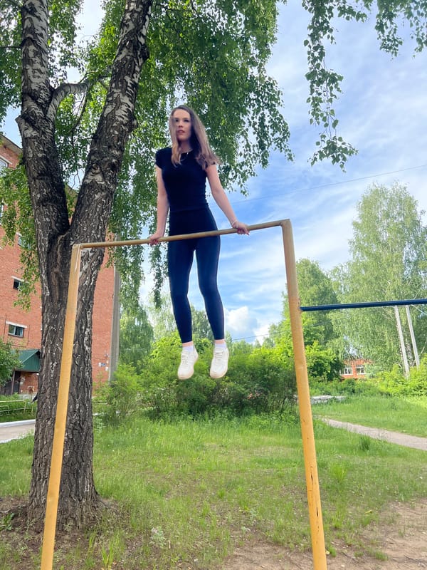 Young women exercise, feed pigeons in Noviy, Russia park