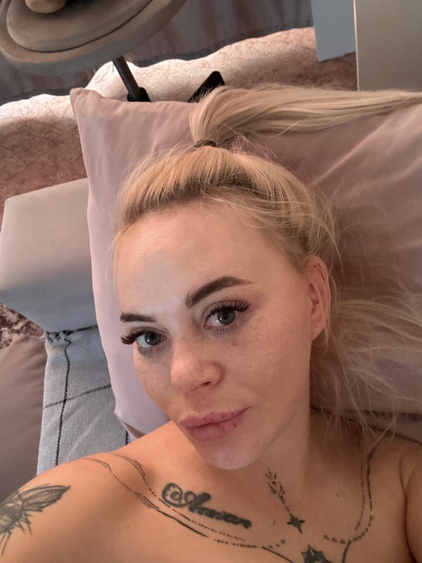 Woman rests in bedroom during early morning hours in Russia