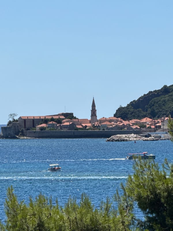 Budva's beach and waterfront buzzing on a July morning