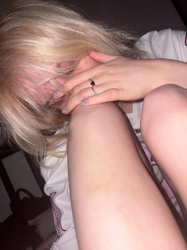 Late-night hang with a pink unicorn and a Reckless tee