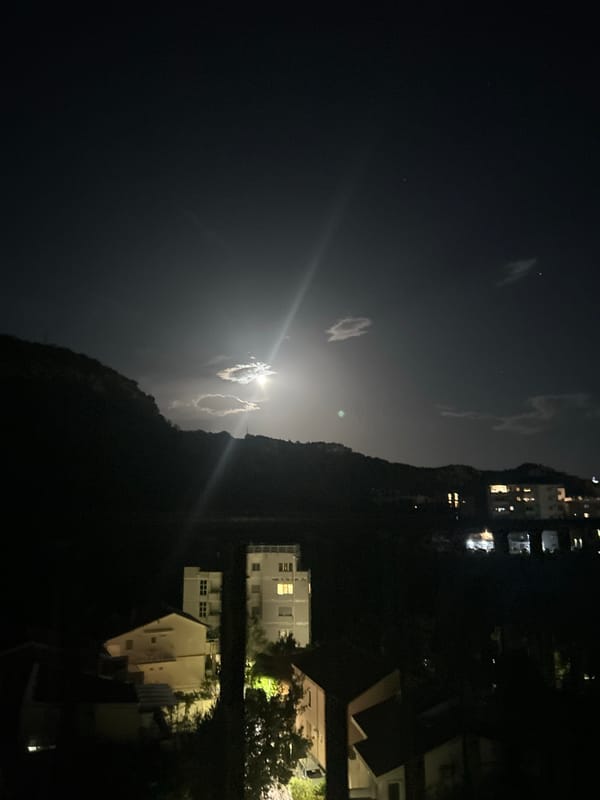 Full moon rising over Rafailovići, Montenegro at night