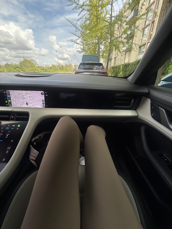 Passenger moment captured inside Porsche in L'Haÿ-les-Roses suburbs