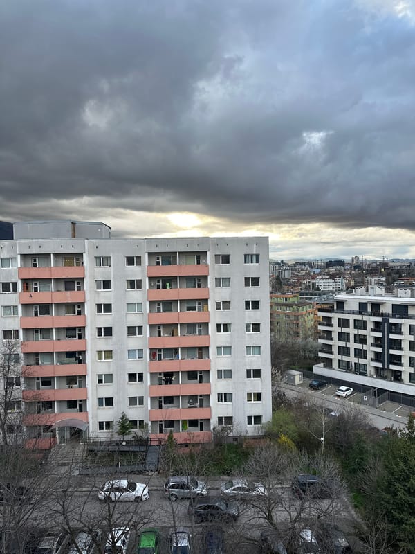 Afternoon sunlight breaks through clouds over Sofia residential area