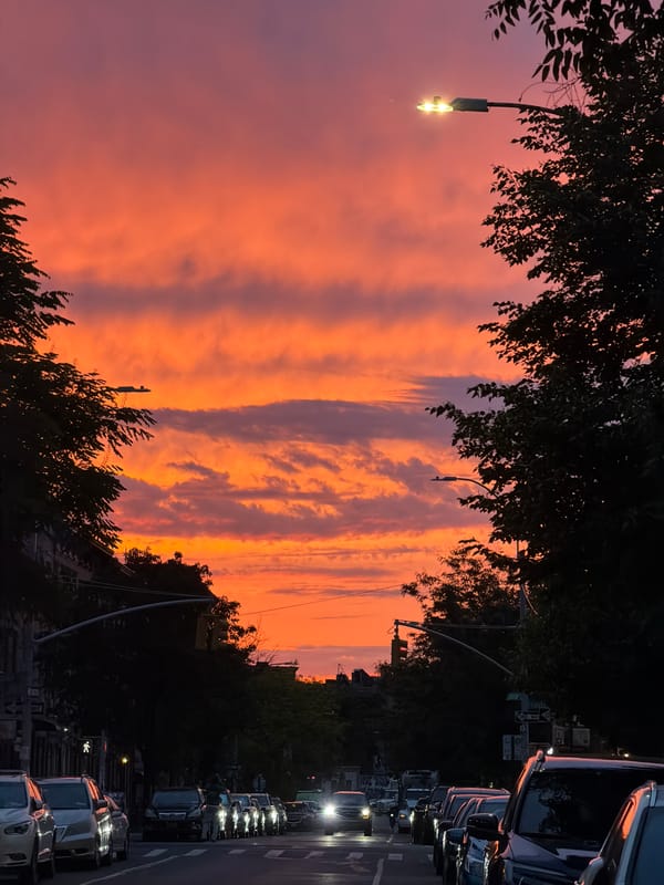 Dusk street scene captured in NYC with colorful sky