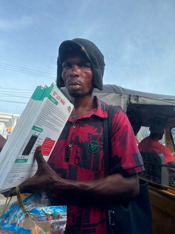 Street vendors conduct afternoon business in Ado, Nigeria