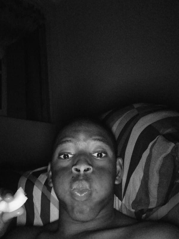 Person photographed eating in bed in Lagos