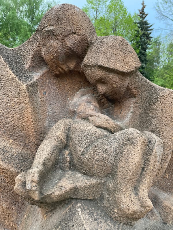 Stone sculpture of two figures photographed in Khimki