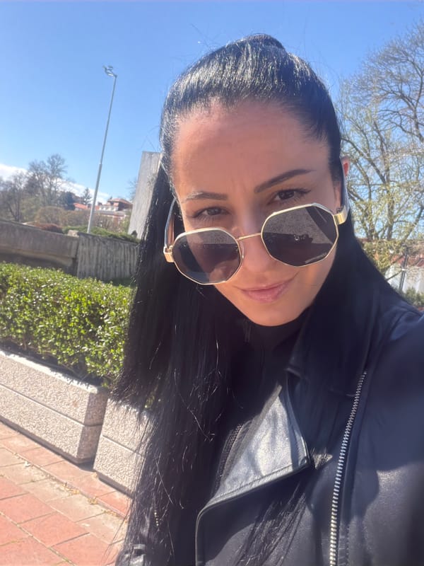 Woman Takes Selfies at Concert Hall in Pleven
