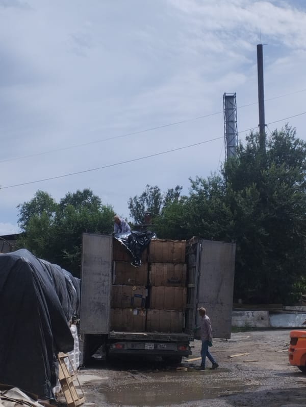 Inside a cardboard recycling and waste processing facility