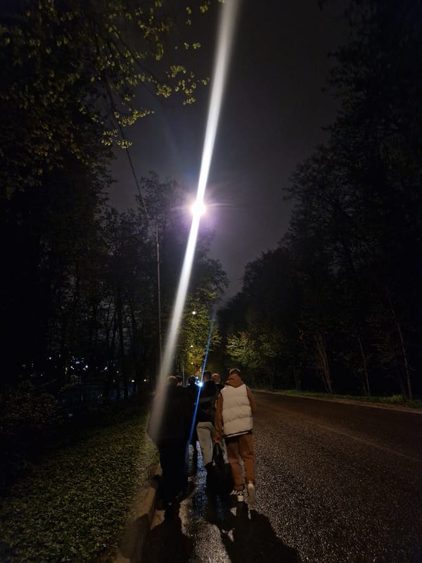 Group directs light beams on wet Moscow pathway