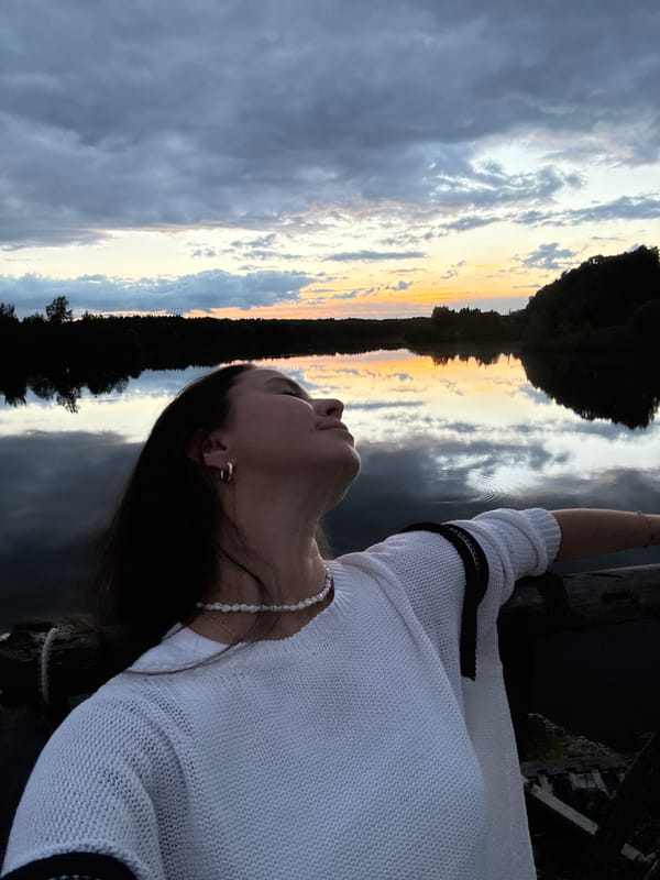 Woman and dog enjoy sunset outing in Kamysh, Russia
