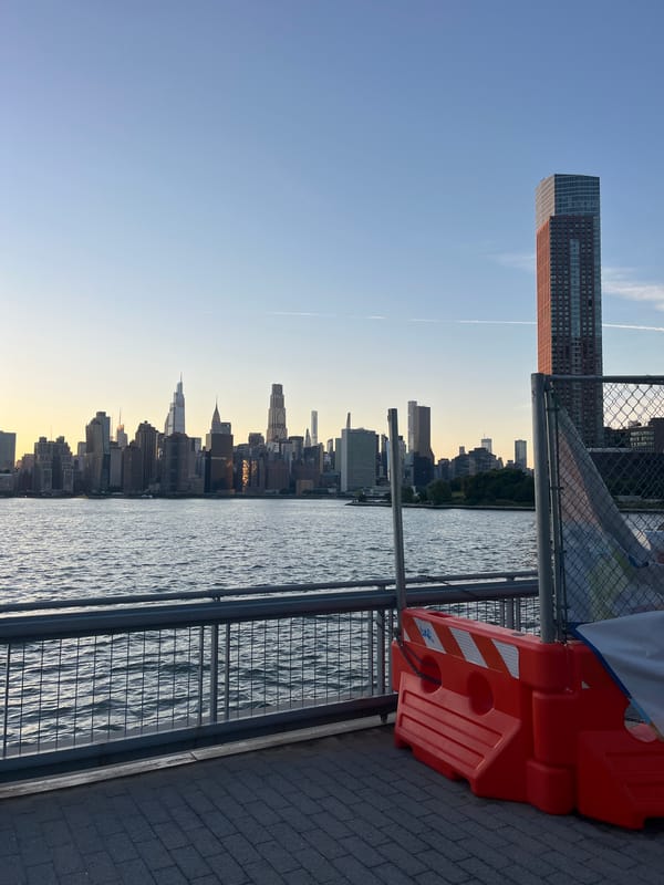 Manhattan skyline at dusk, seen from East River waterfront
