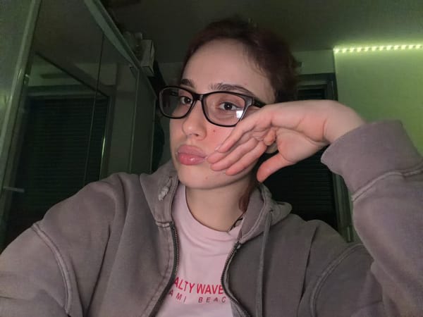 Two people take selfies indoors in Strasbourg