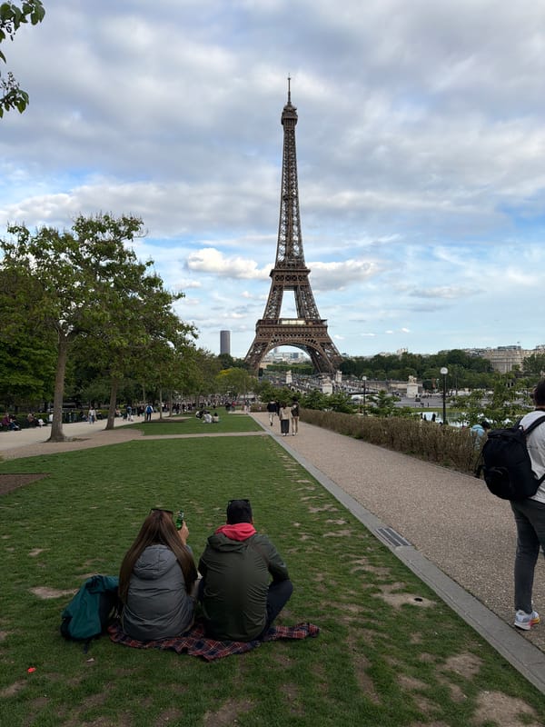 Tourist photographs Eiffel Tower from multiple angles at Trocadéro