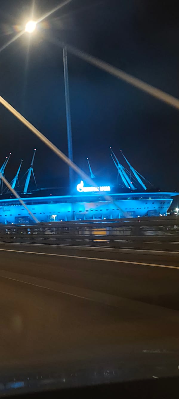 Gazprom Arena and cable-stayed bridge lit up at night