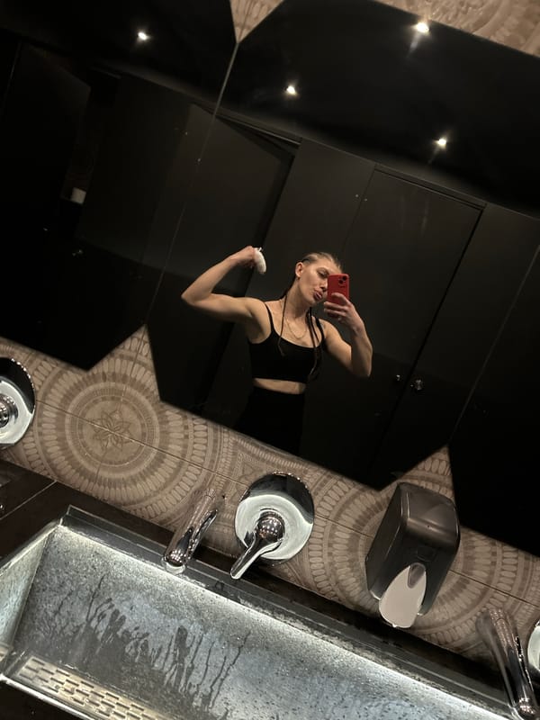 Person takes playful bathroom mirror selfie in Varna