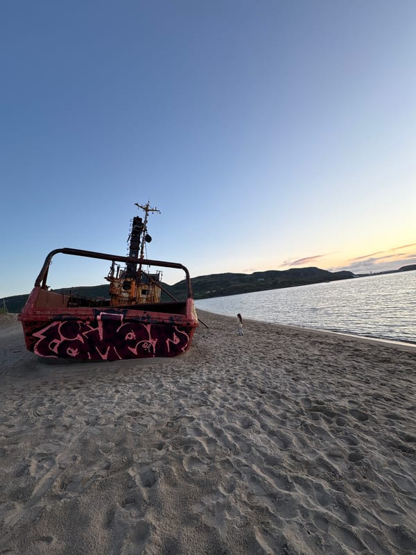 Abandoned shipwreck and quiet beachside moment in Teriberka