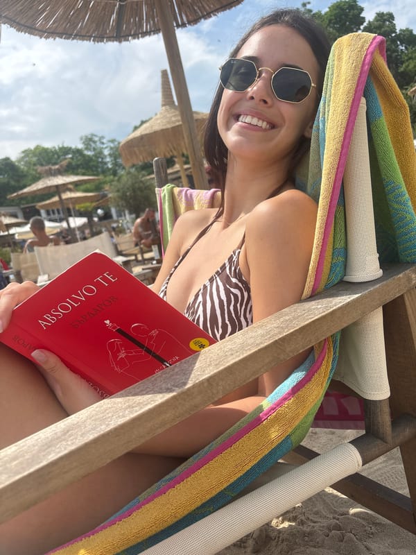 Beachgoer reads Bulgarian book while relaxing in Varna
