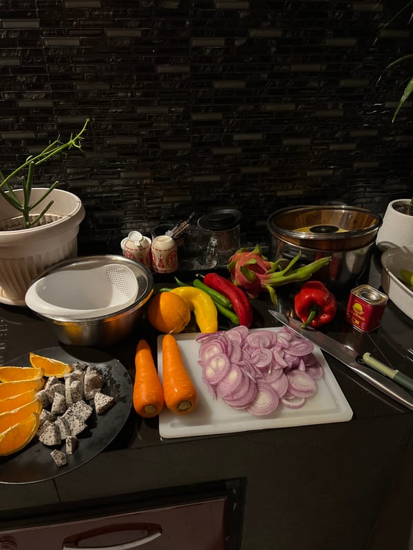 Kitchen meal prep documented with colorful ingredients and utensils