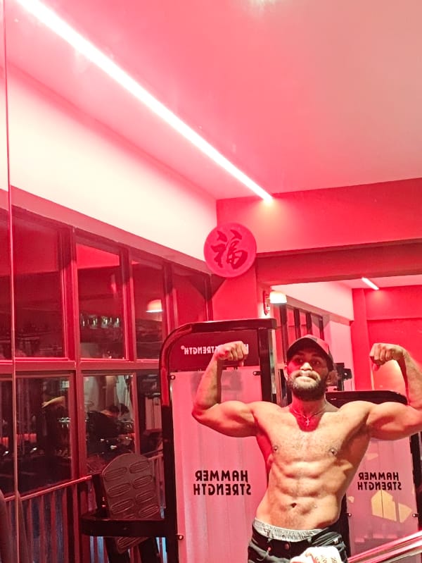 Man Takes Mirror Selfies in Red-Lit Chongqing Gym