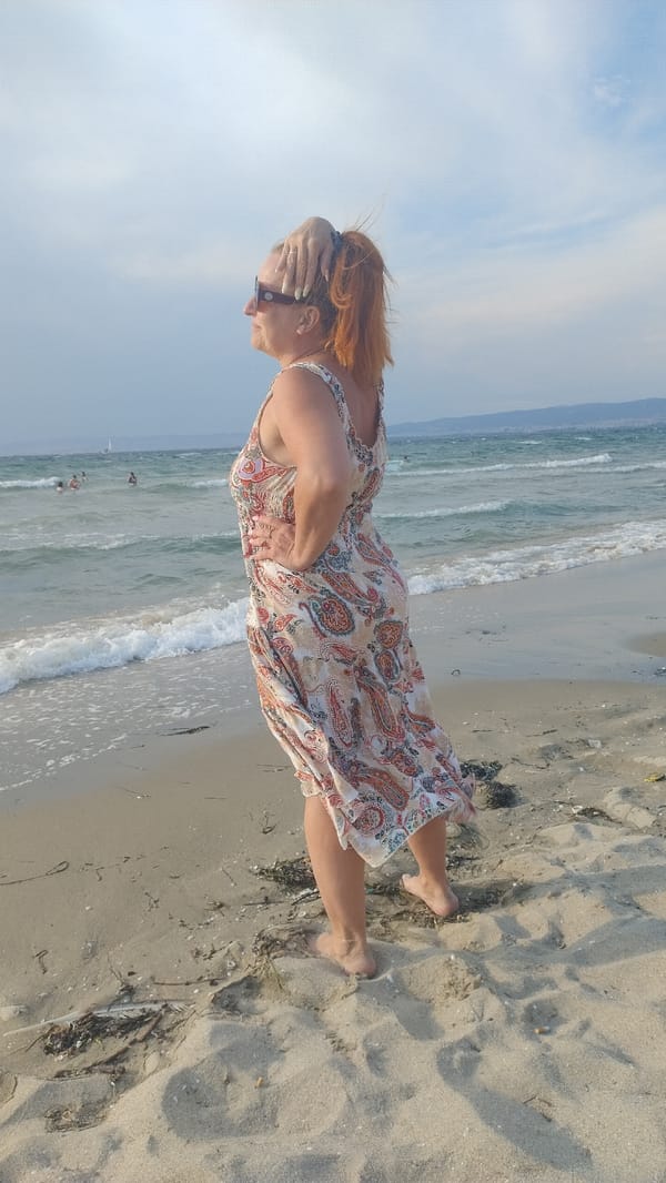 Lazy afternoon on a Greek beach, Aegean in the background