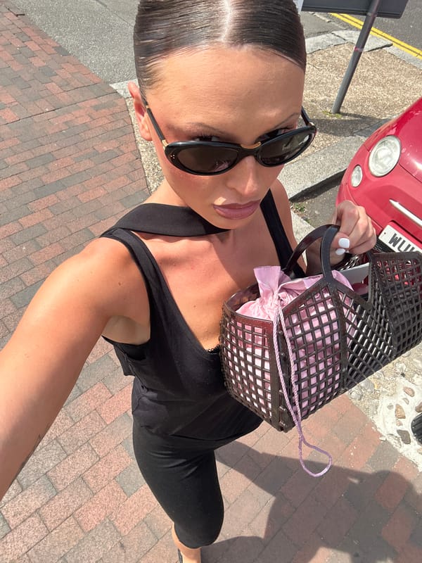 Woman in black observed on Tunbridge Wells sidewalk