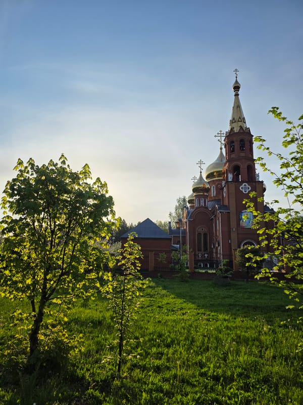 Woman visits Orthodox church grounds in Chaikovsky, Russia