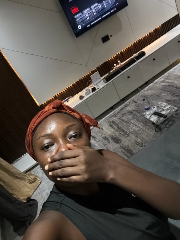 Woman watches Netflix at home in Nigeria evening