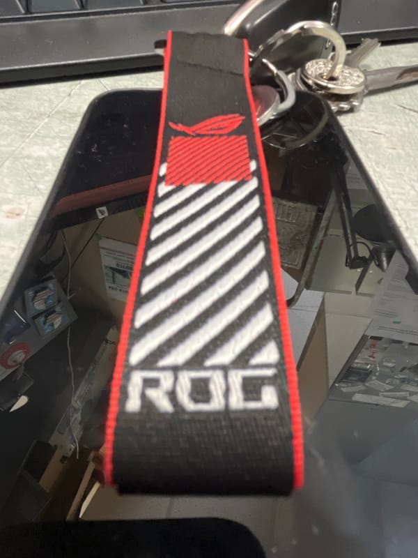 ROG-branded keychain with striped pattern observed in close-up