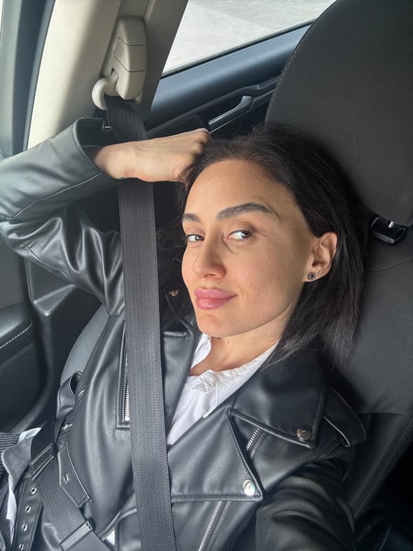 Woman photographed in car and apartment interior in Tbilisi