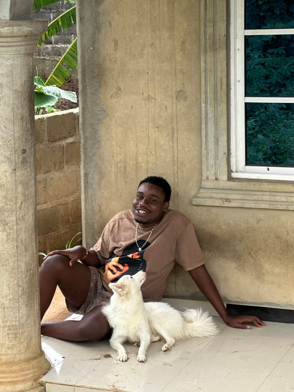 Man and white dog spend morning in Ikot Ekpene neighborhood