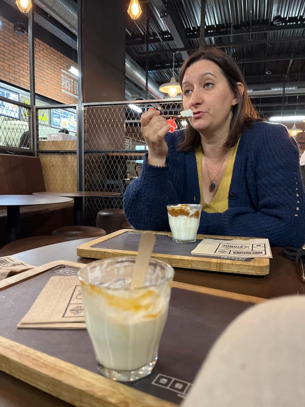 Woman enjoys dessert in Andrézieux-Bouthéon dining moment
