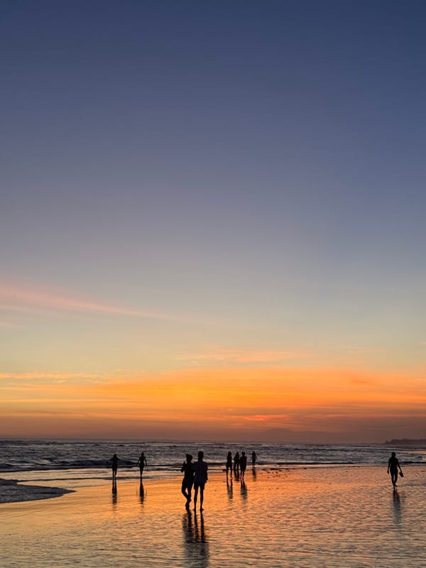 Bali beach sunset draws a crowd to the shoreline