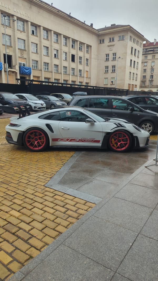 Sofia street scenes feature historic churches, luxury sports car