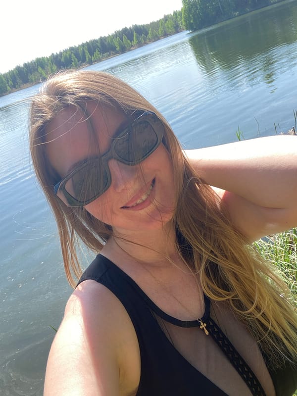 Woman in swimsuit enjoys waterside moment in Novyi, Russia