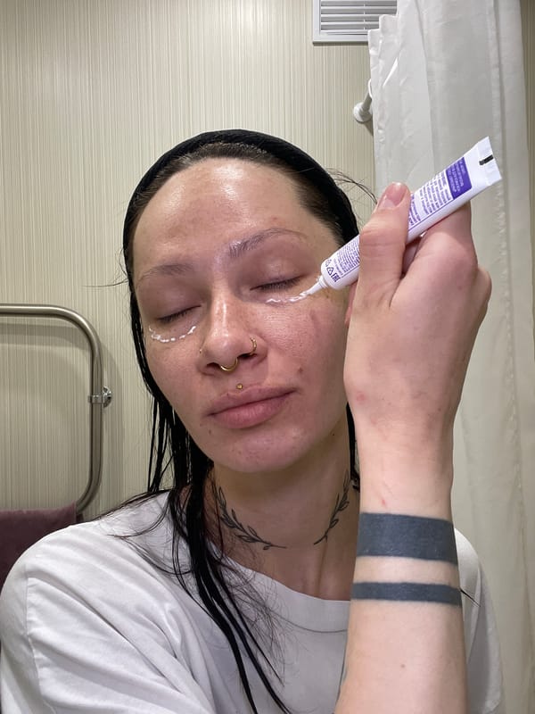 Woman applies facial cream in Izhevsk morning routine