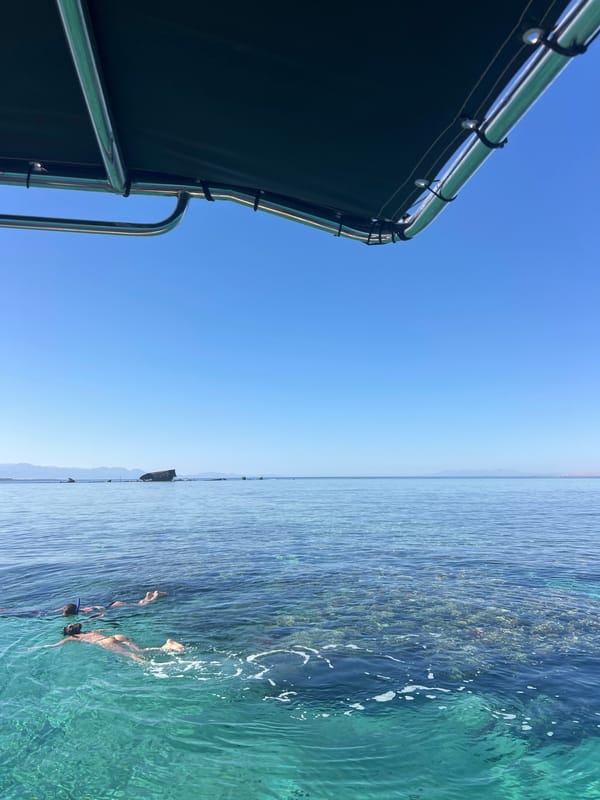 Calm Red Sea waters off Egypt's coast, coral reef visible below