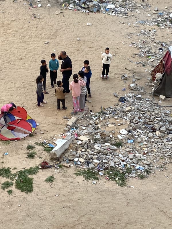 Children gather in debris-filled areas of Khan Yunis