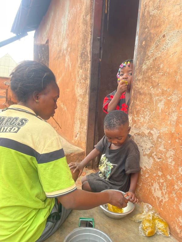 Children gather for early morning meal in Ogbe, Nigeria