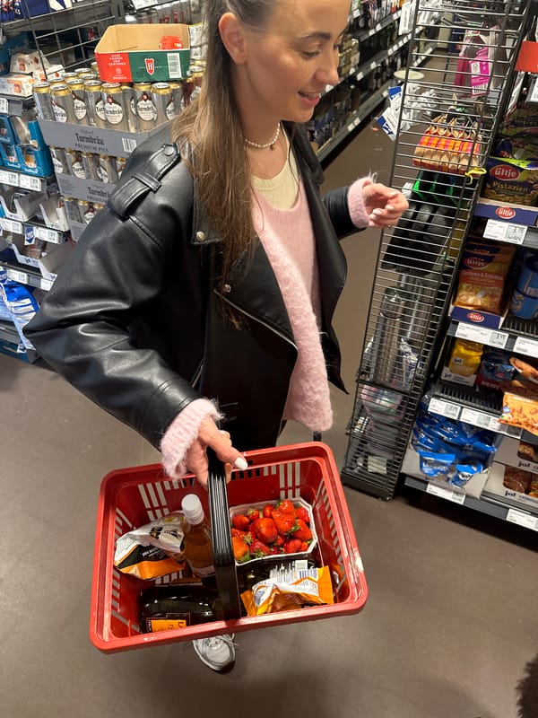 Woman shops for groceries at REWE store in Kiel