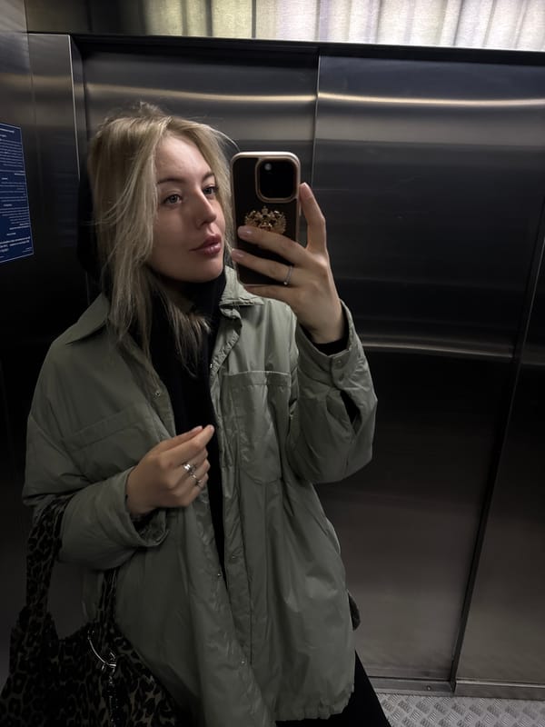 Woman Takes Selfie in Elevator in Krasnoyarsk