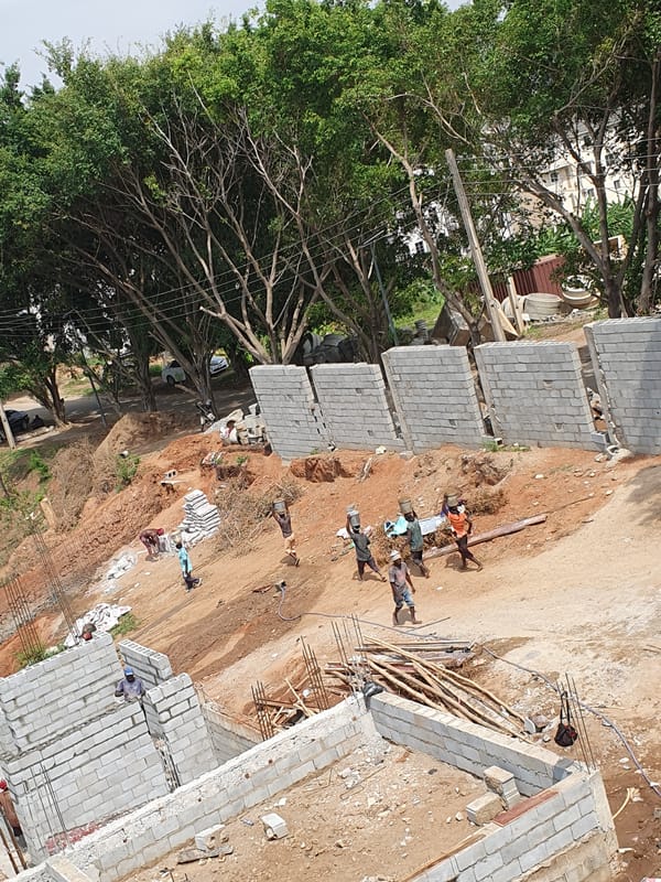 Construction workers build foundations at Abuja site