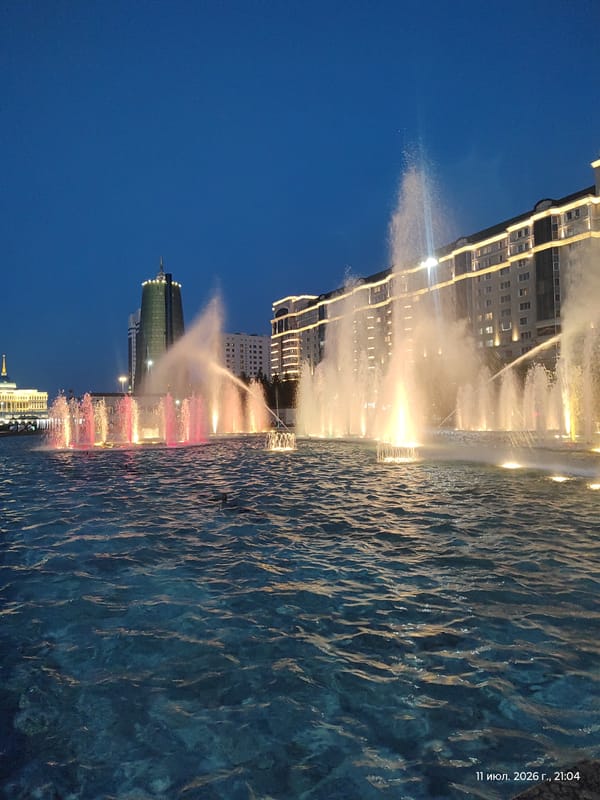 Colorful fountain lights up a central Astana landmark at night