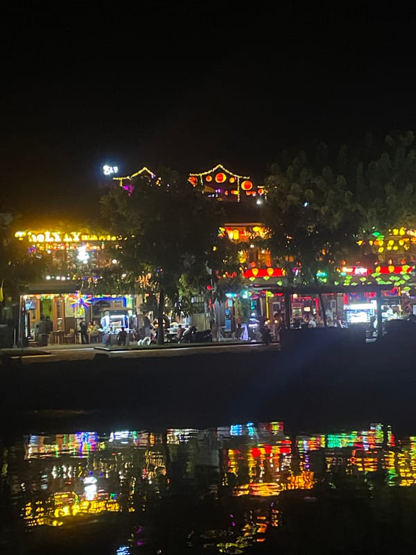 Hoi An at night: lanterns, river reflections, and glowing streets