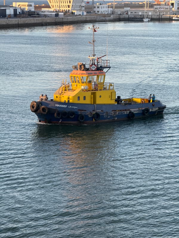 Harbor traffic in Casablanca: tugs, pilot boats, and barges at work