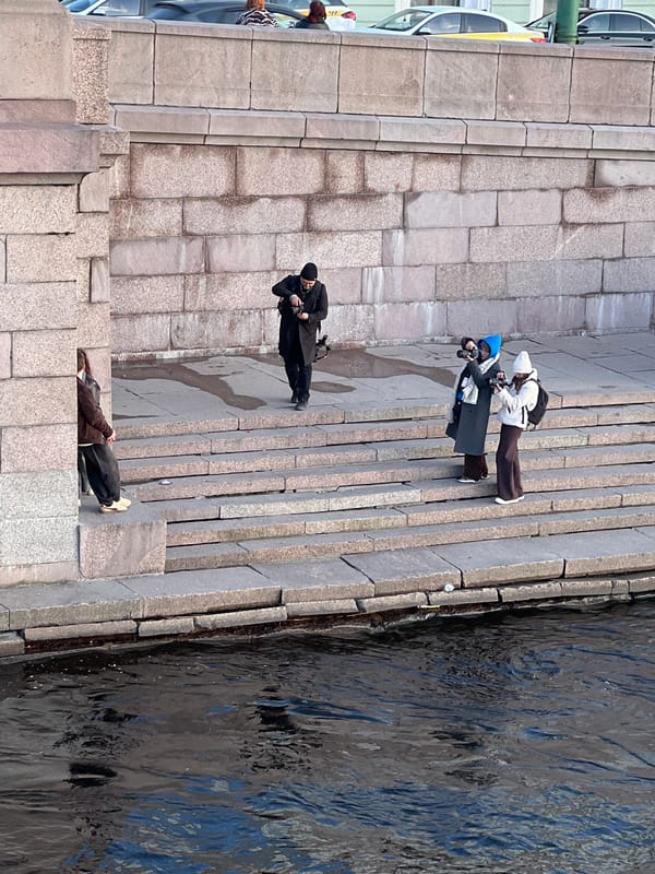 Photo session held on Neva River steps in Saint Petersburg